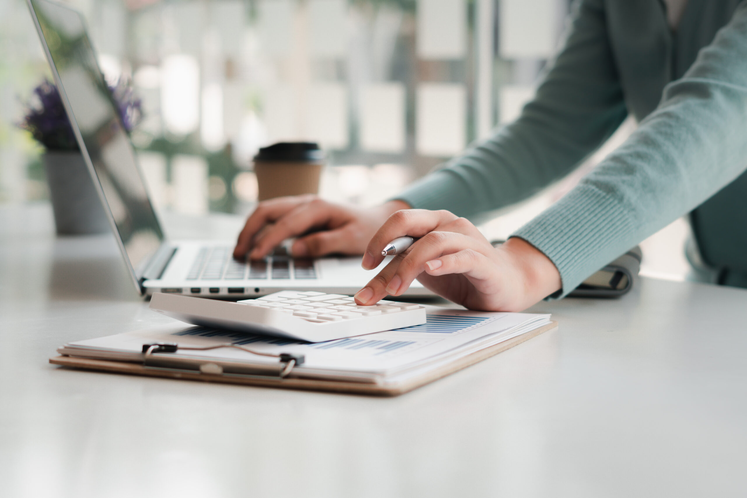Businessman,Working,On,Desk,Office,With,Using,A,Calculator,To