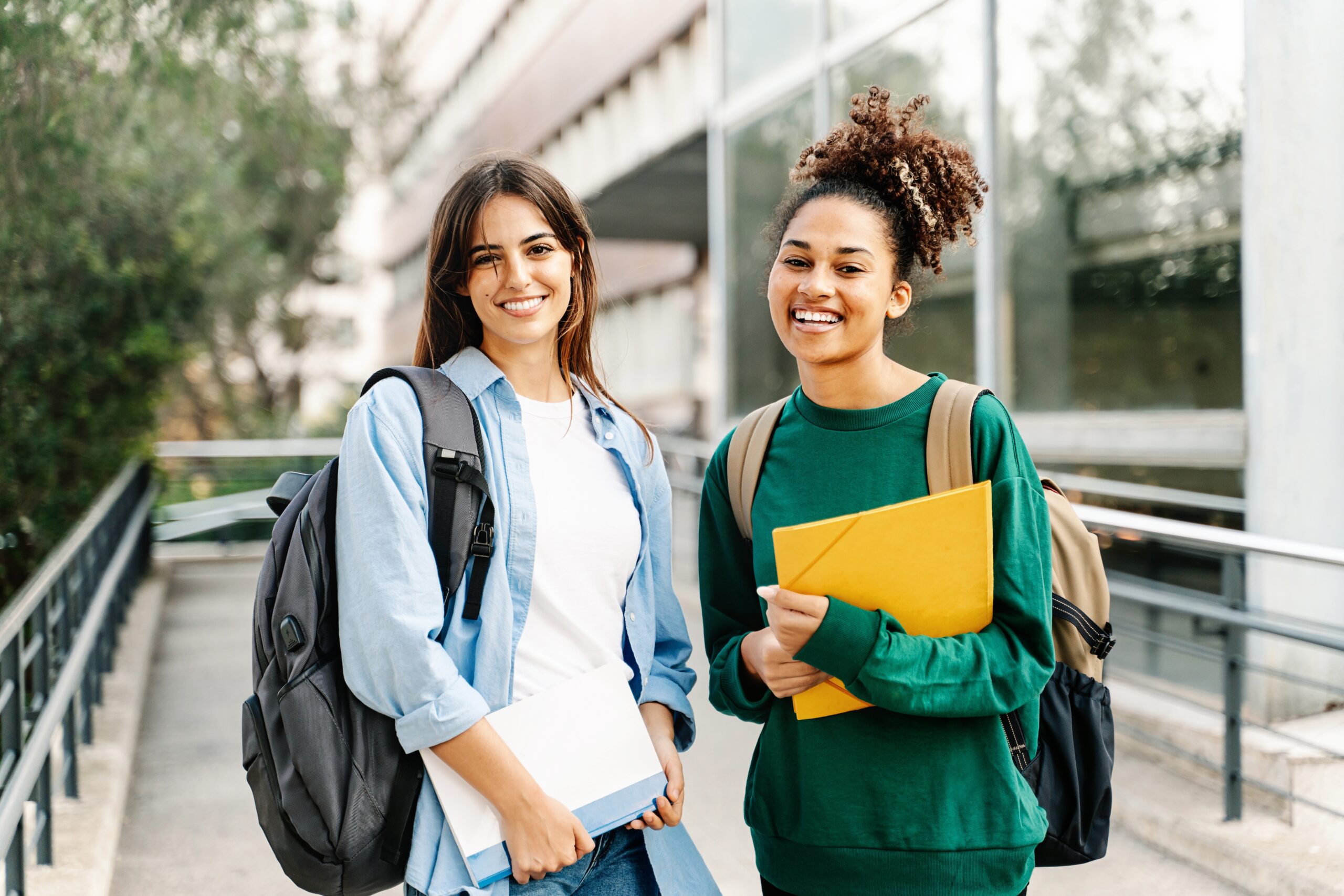 Two,College,Student,Female,Friends,Smiling,Ready,For,Classes,At