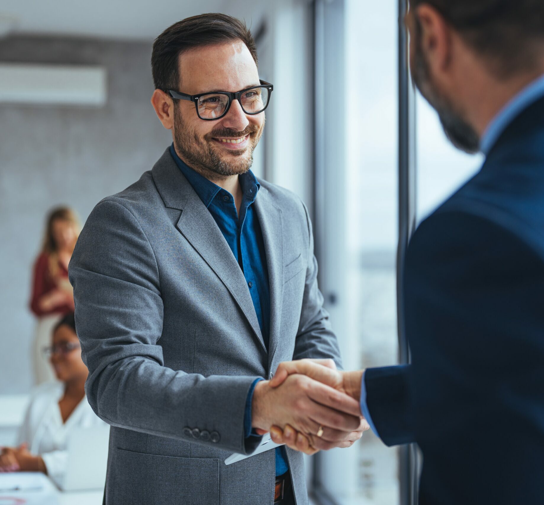 Portrait,Of,Cheerful,Young,Manager,Handshake,With,New,Employee.,Business