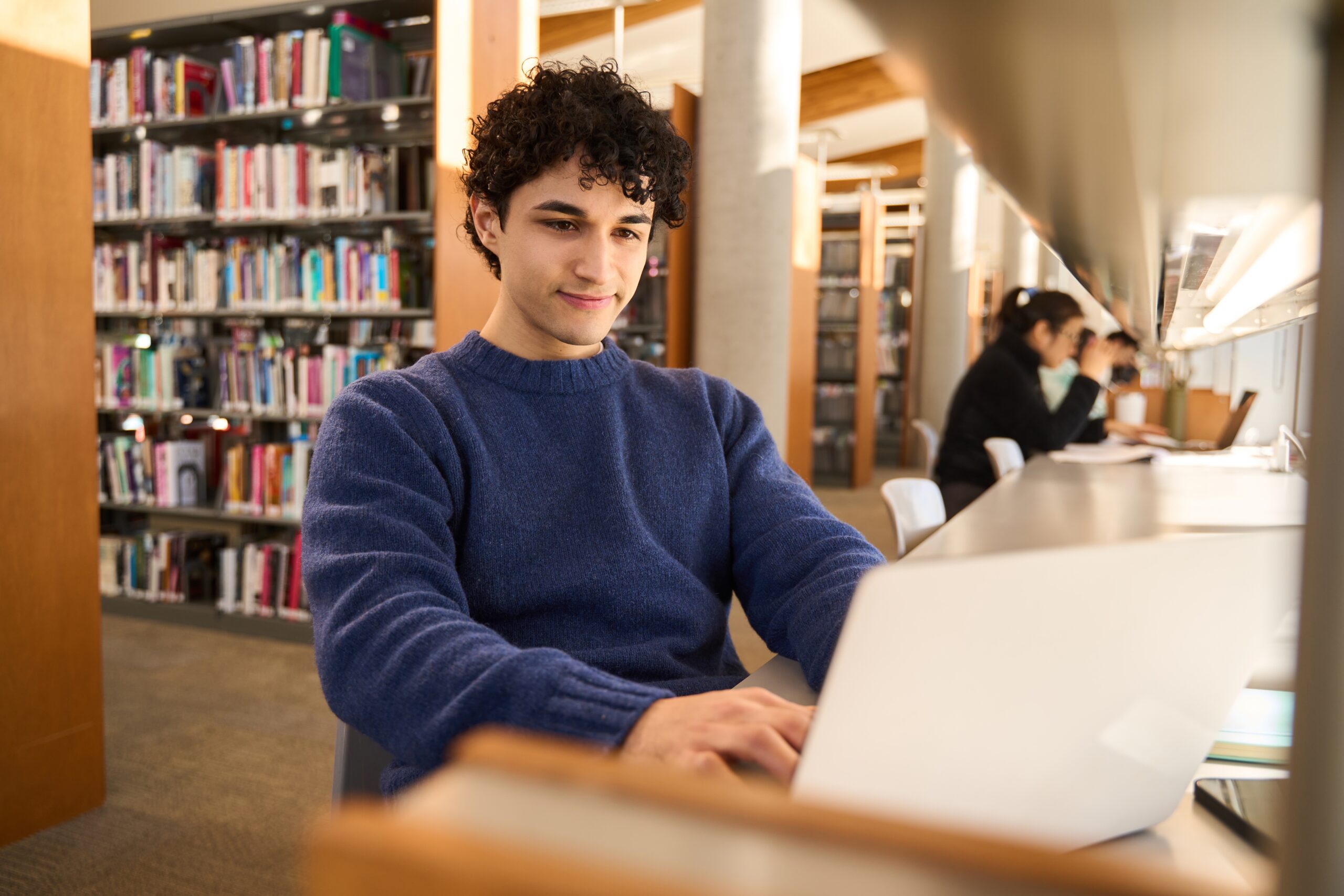 Latin,American,Male,Student,Using,Laptop,,Focused,On,Working,On